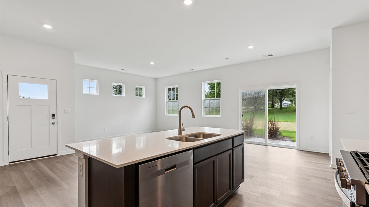 New build home features central island design, pantry, multi-prep zones, sink, dining and living rooms, outside areas