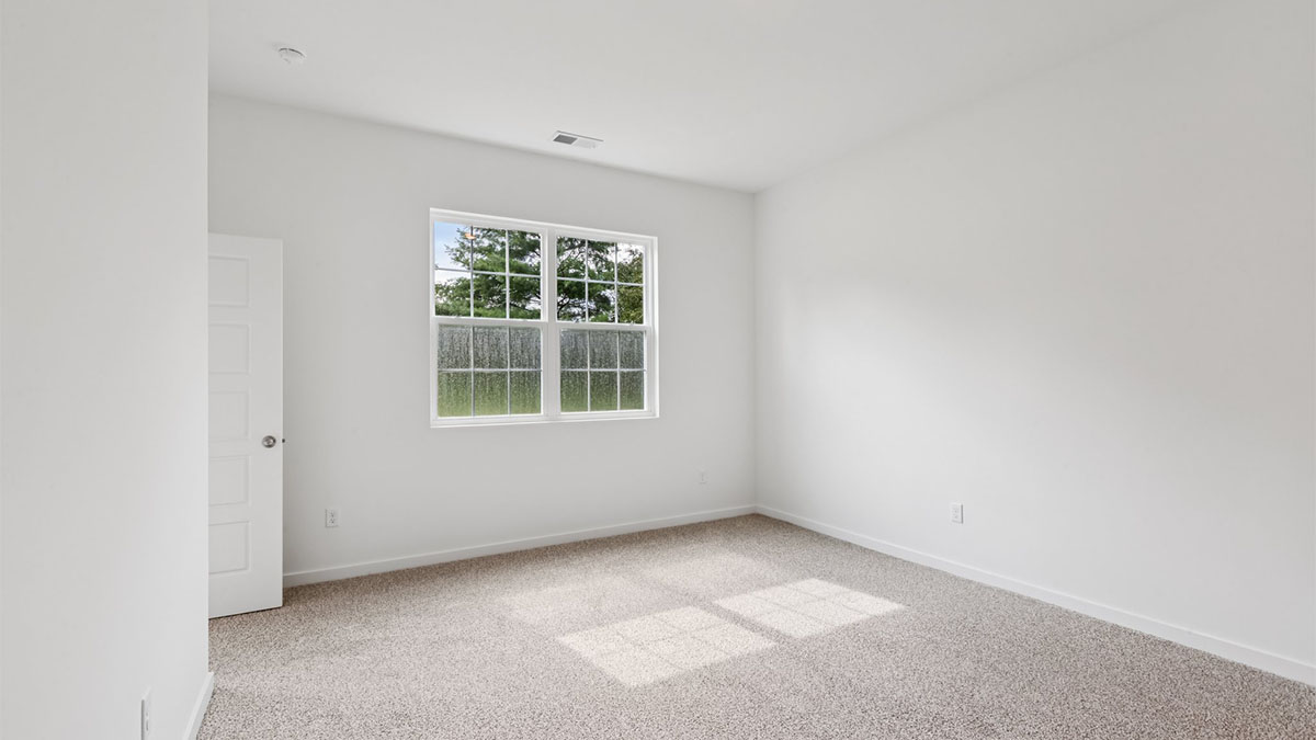 Owner’s suite offers natural window light, spa-inspired ensuite bathroom, backyard view, walk-in closet for everyday style