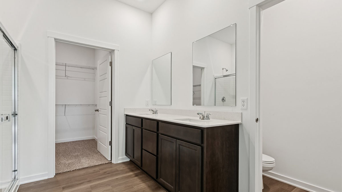 Owner’s ensuite in a new build home offers function and style with a walk-in closet, spa-like ensuite