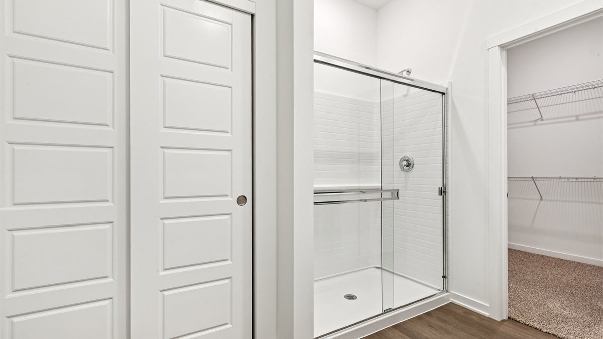 Owner’s ensuite in a D.R. Horton new build home offers function and style with a walk-in closet, spa-like ensuite