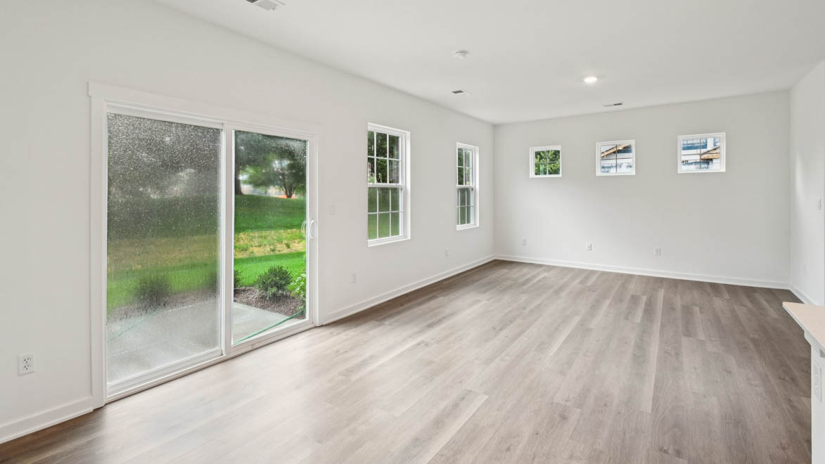 View from dining room into kitchen with island, pantry, new appliances and cabinet options at Stonewater