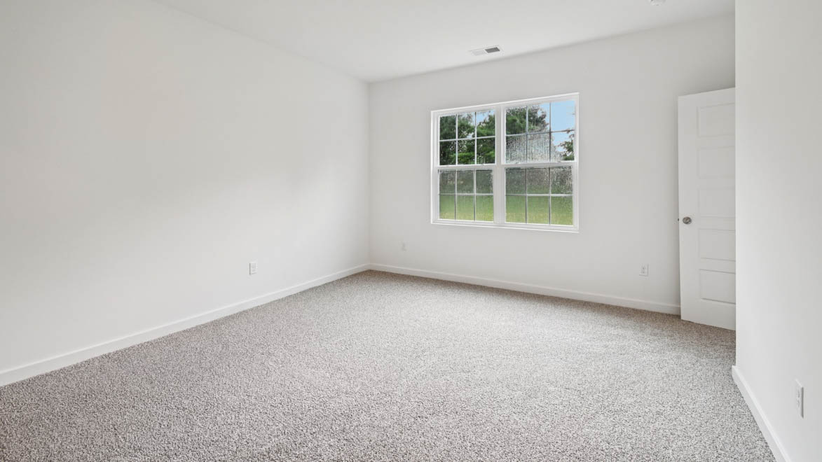 Owner’s suite offers natural window light, spa-inspired ensuite bathroom, backyard view, walk-in closet for everyday style