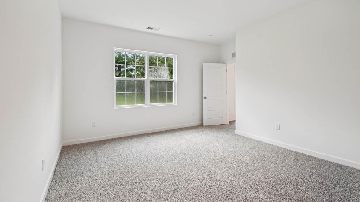 Primary bedroom designed with privacy and space in mind with a flow into a spa-inspired ensuite bathroom and walk-in closet
