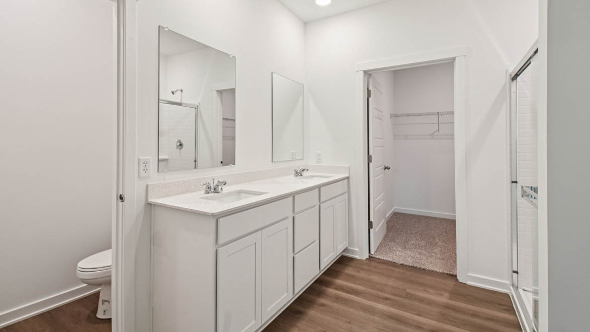 Owner’s ensuite in a new build home offers function and style with a walk-in closet, spa-like ensuite