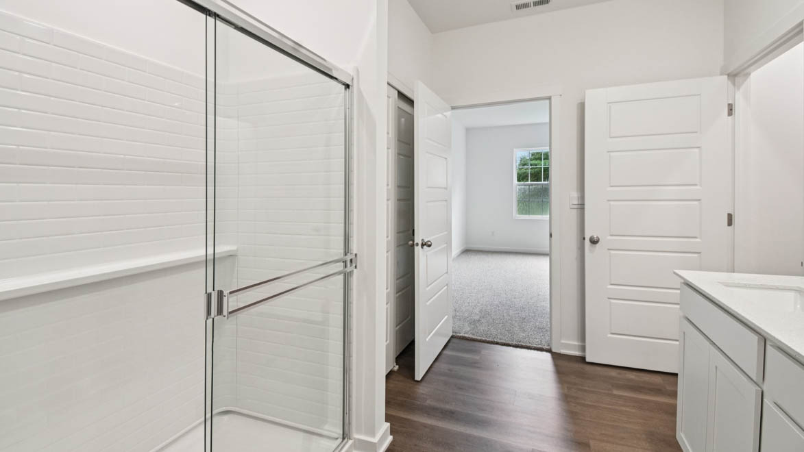 Owner’s ensuite in a D.R. Horton new build home offers function and style with a walk-in closet, spa-like ensuite