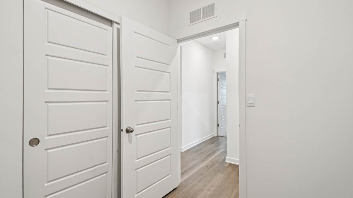 Modern laundry room in Stonewater  with new washer, dryer included, smart shelving, clean finishes, and storage