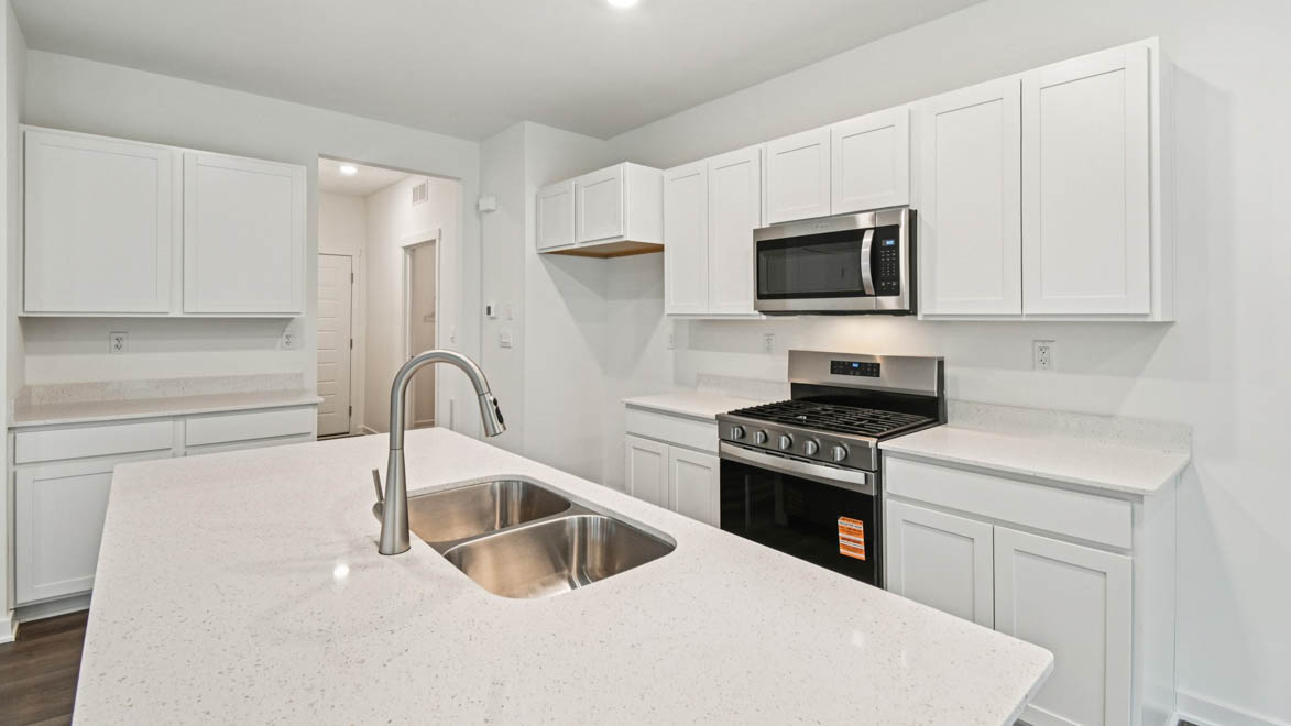 New appliances included, our larger kitchen island with seating anchor the kitchen, next to dining, great rooms, pantry