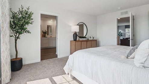 Primary bedroom with connecting en suite