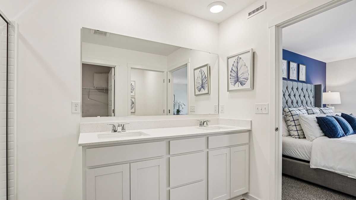 primary en suite bathroom with double bowl vanity