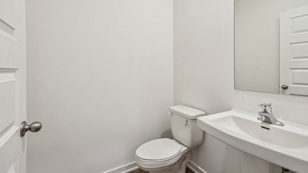 Powder room off of garage entrance