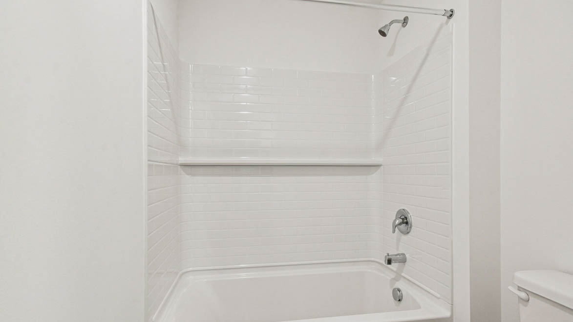 Secondary bathroom toilet, tub and shower