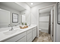 Bathroom with shower and double bowl vanities in Ivanhoe Holcombe model