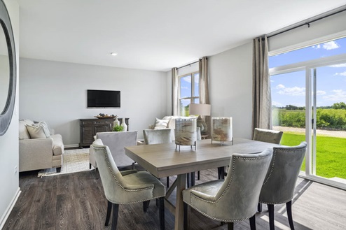 Open concept dining room overlooking great room in Ivanhoe Holcombe model