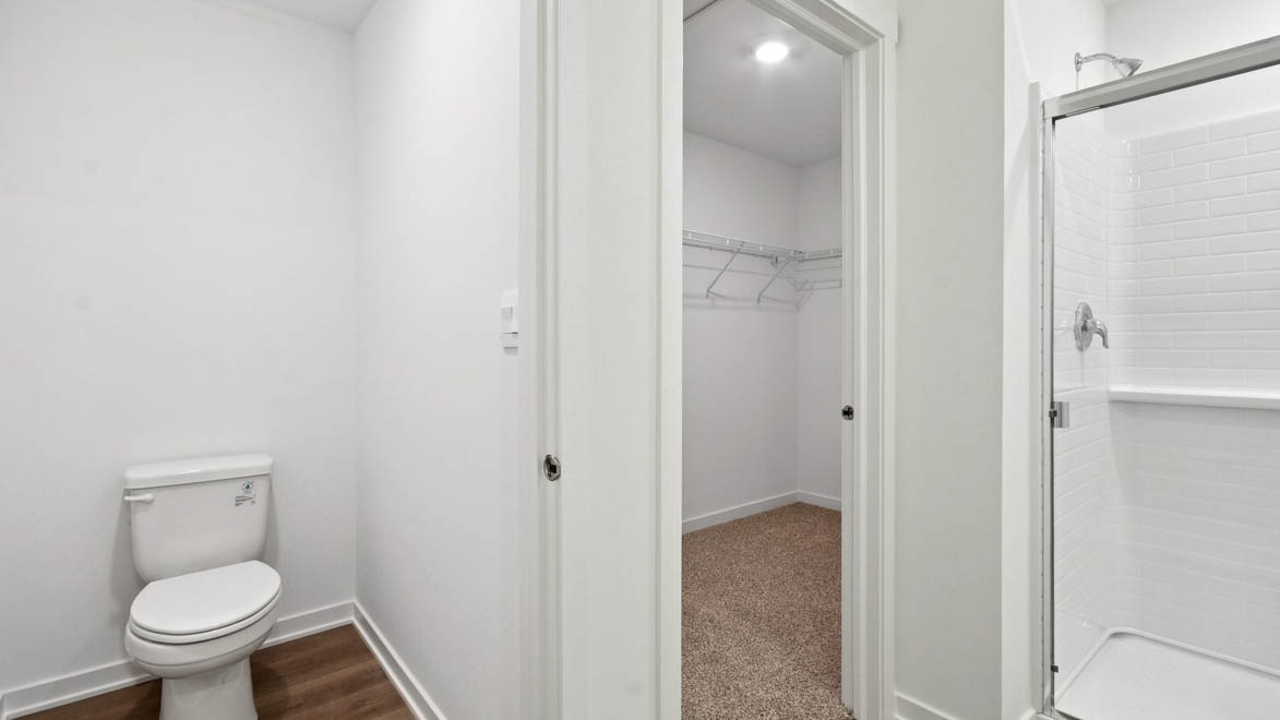 primary bathroom with walk in closet