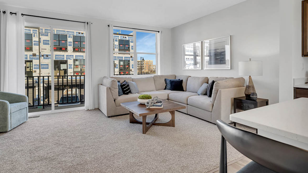 great room with sliding door to balcony