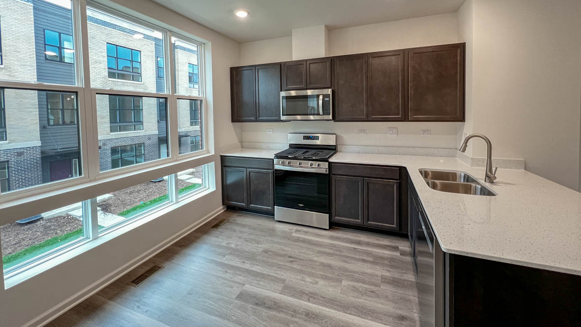 kitchen interior with dark cabinets