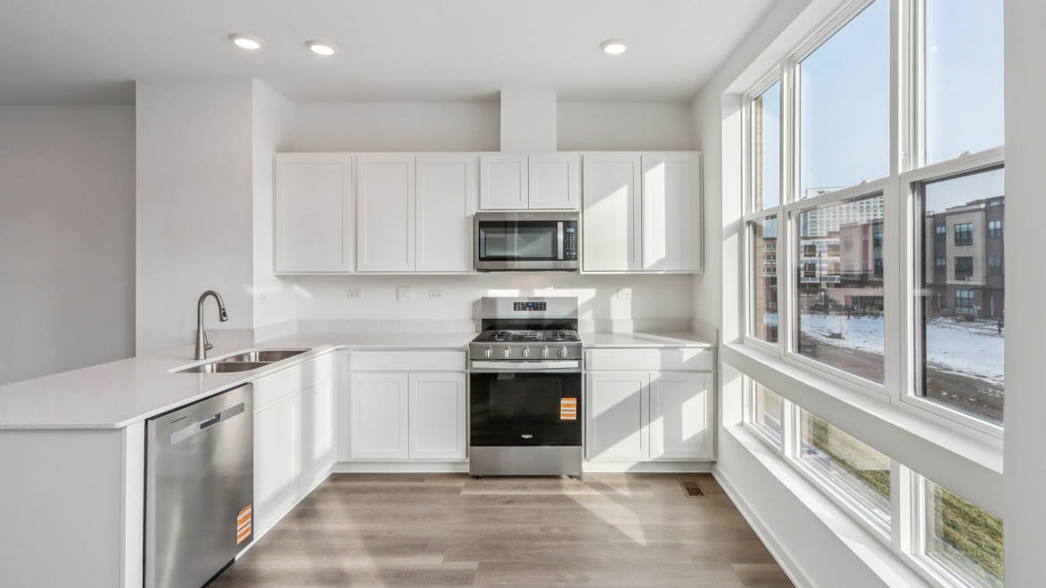 Kitchen with white cabinets and quartz countertops