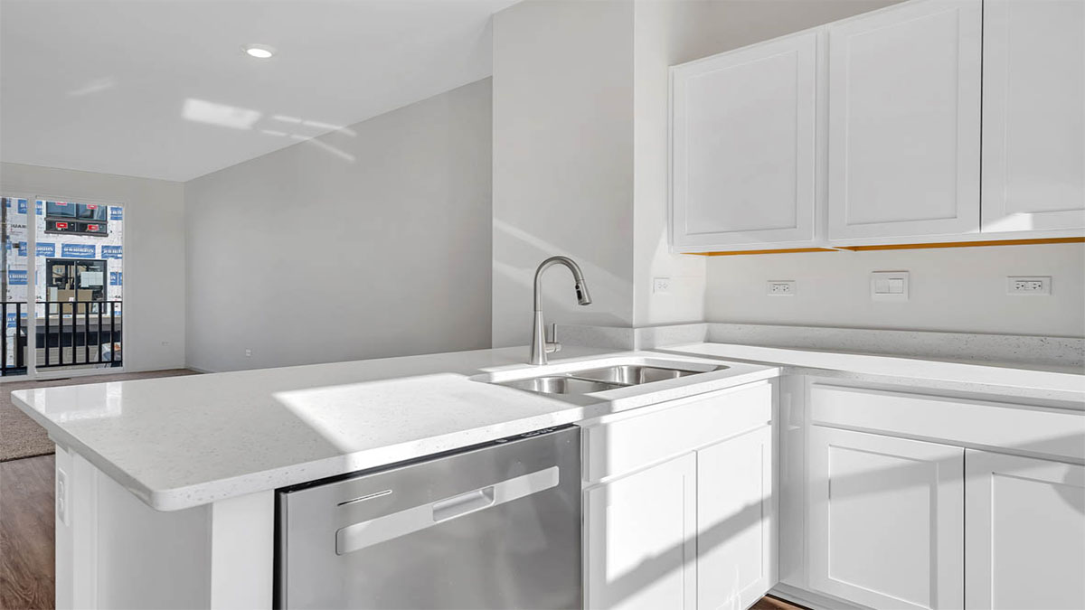 Kitchen with white cabinets and quartz countertops