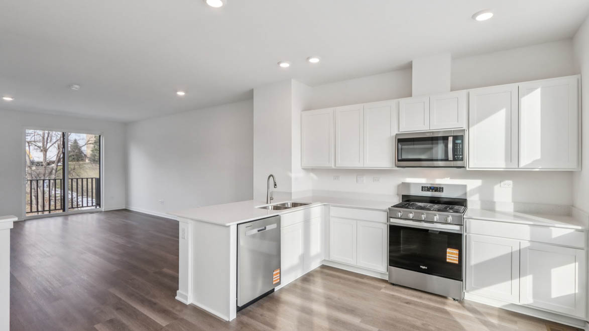 kitchen with white cabinets and white quartz countertops