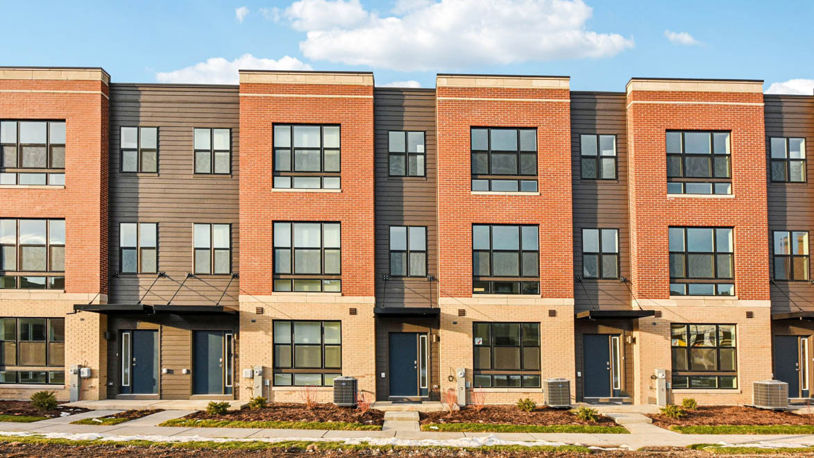 Tri level townhome with red brick