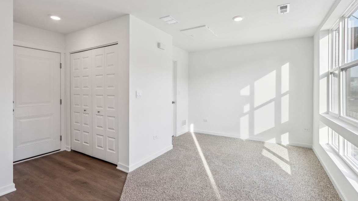 hallway leading to garage and utilites