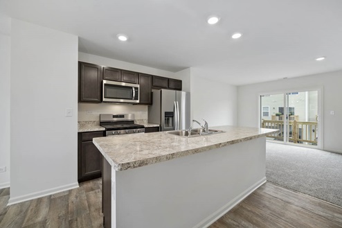 kitchen with dark cabinets