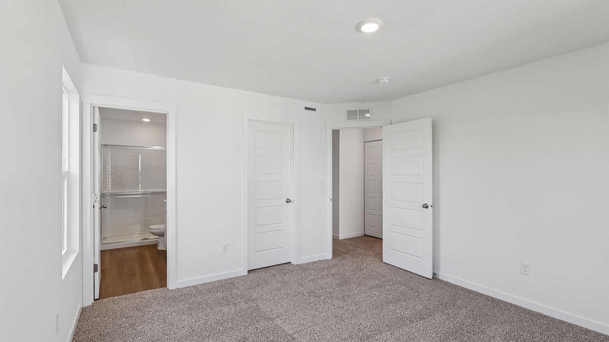 Primary bedroom with connecting en suite