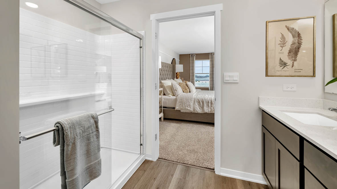 Primary bathroom with walk in shower and water closet