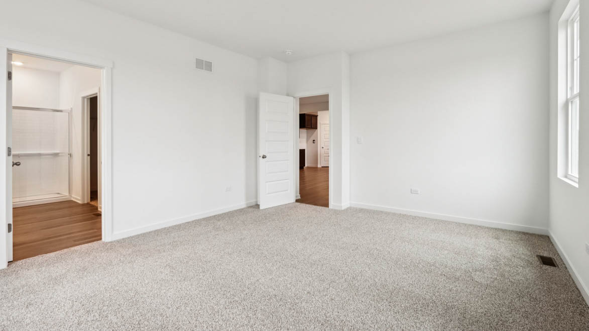 primary bedroom with connecting en suite