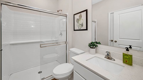 First floor full bathroom off of garage entrance