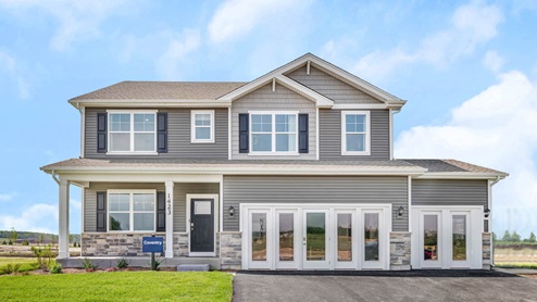 Sonoma trails coventry model in Oswego Illinois with a 3 car garage and a front porch