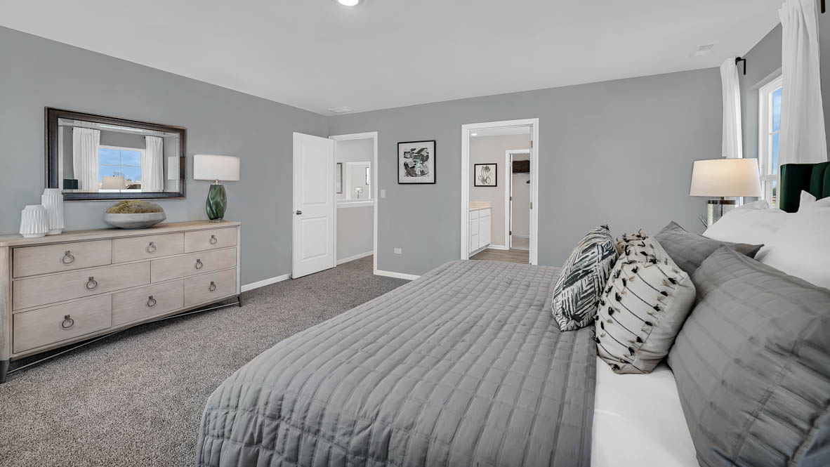 Primary bedroom with connecting en suite