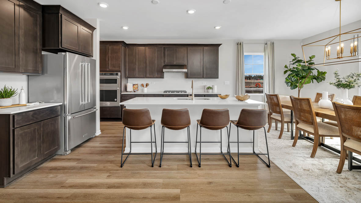 Gourmet Kitchen with 42 inch dark cabinets, white quartz countertops, soft close drawers and large kitchen island