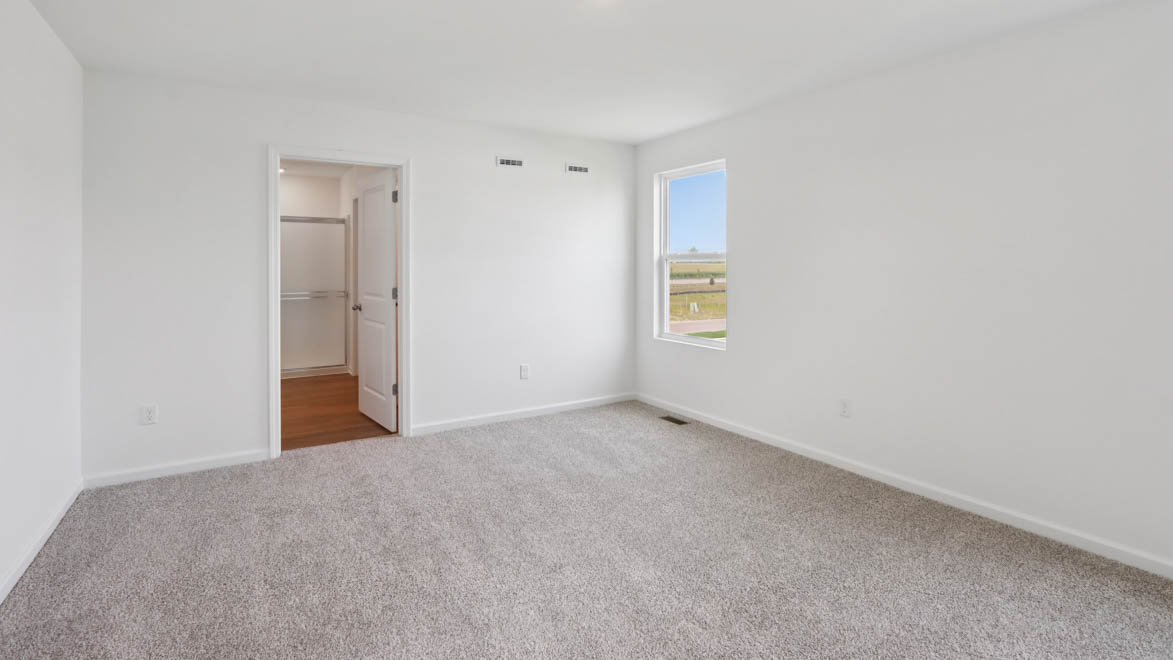 Primary bedroom with connecting en suite