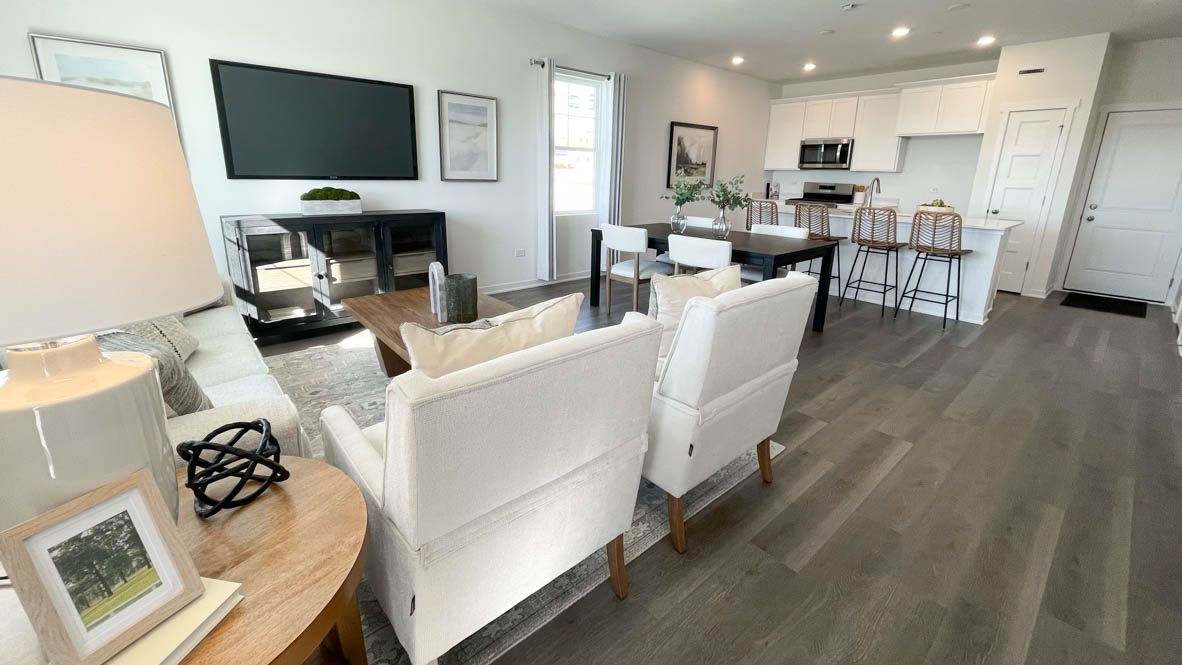 Open concept layout with great room, dining room and kitchen