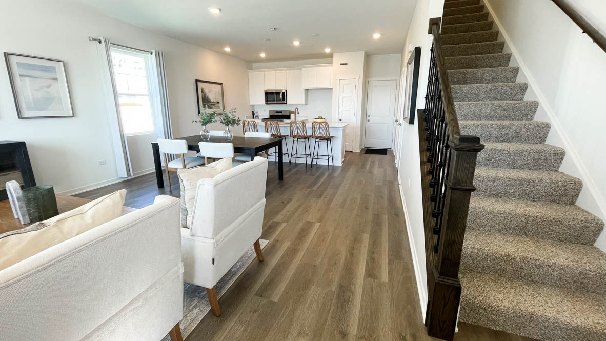 Entrance to Richmond with straight staircase on one side and the great room on the other