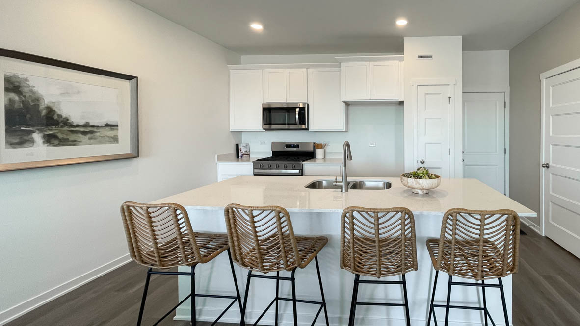 Kitchen with white 42 inch cabinets and white quartz countertops