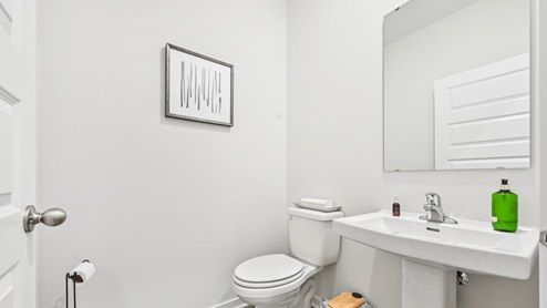 Powder room off of garage entrance