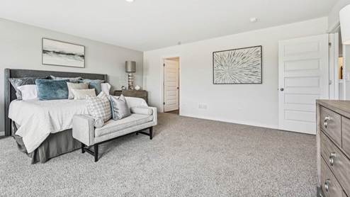 Primary bedroom with connecting en suite
