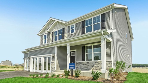 Coventry model with a 3 car garage and stone and vinyl siding