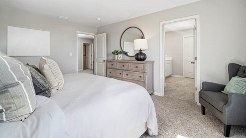 Primary bedroom with connecting en suite