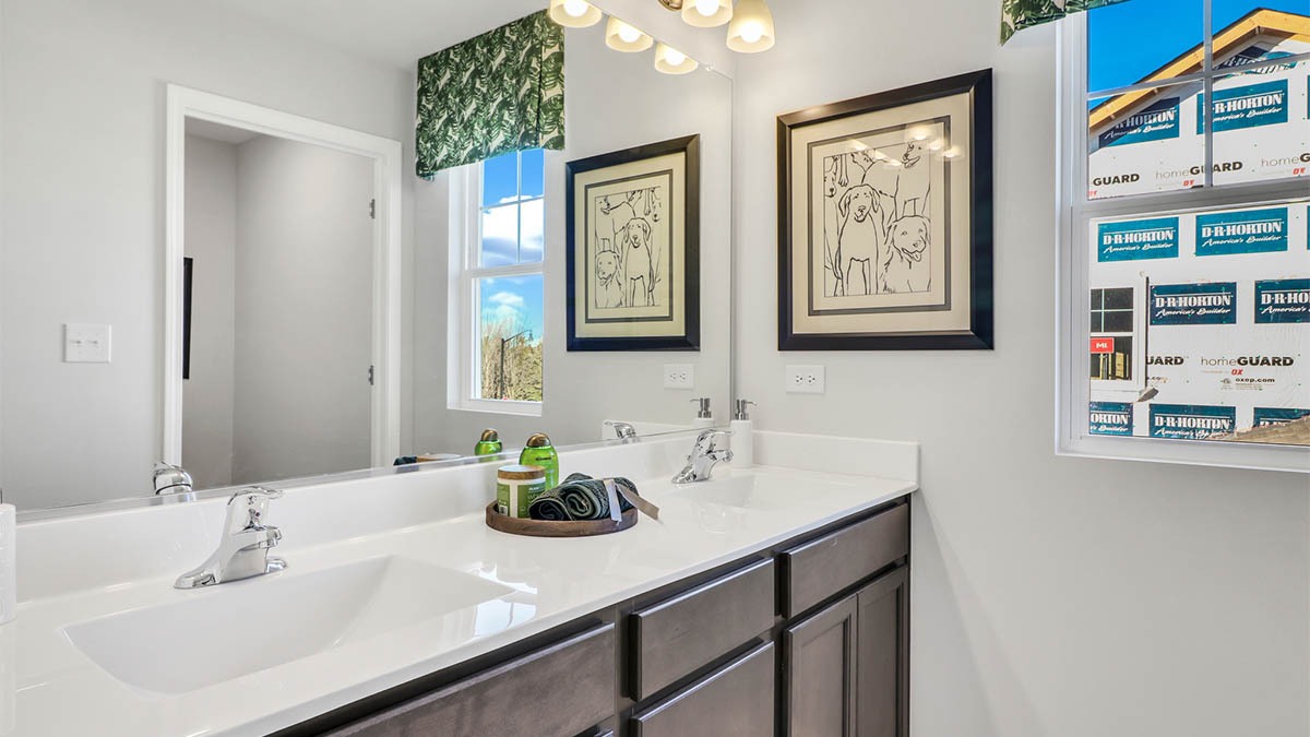 Secondary full bathroom with dual sinks