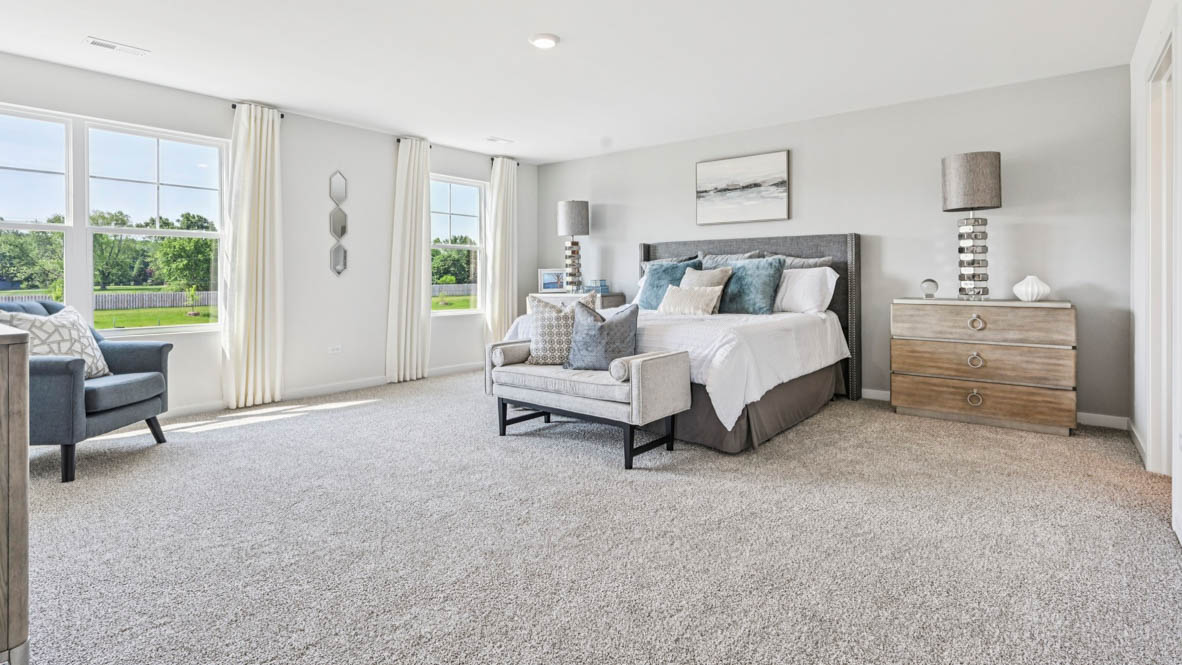 Upper level primary bedroom with connecting ensuite