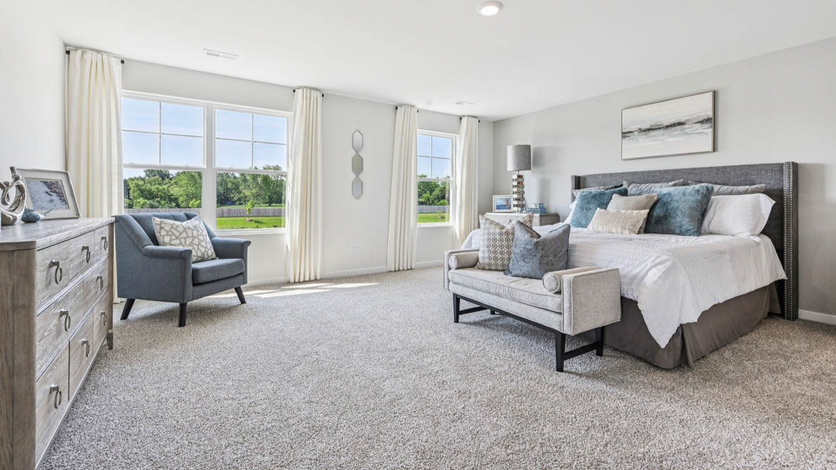 Upper level primary bedroom with connecting ensuite