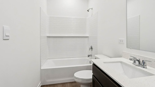 full bathroom with dual sinks