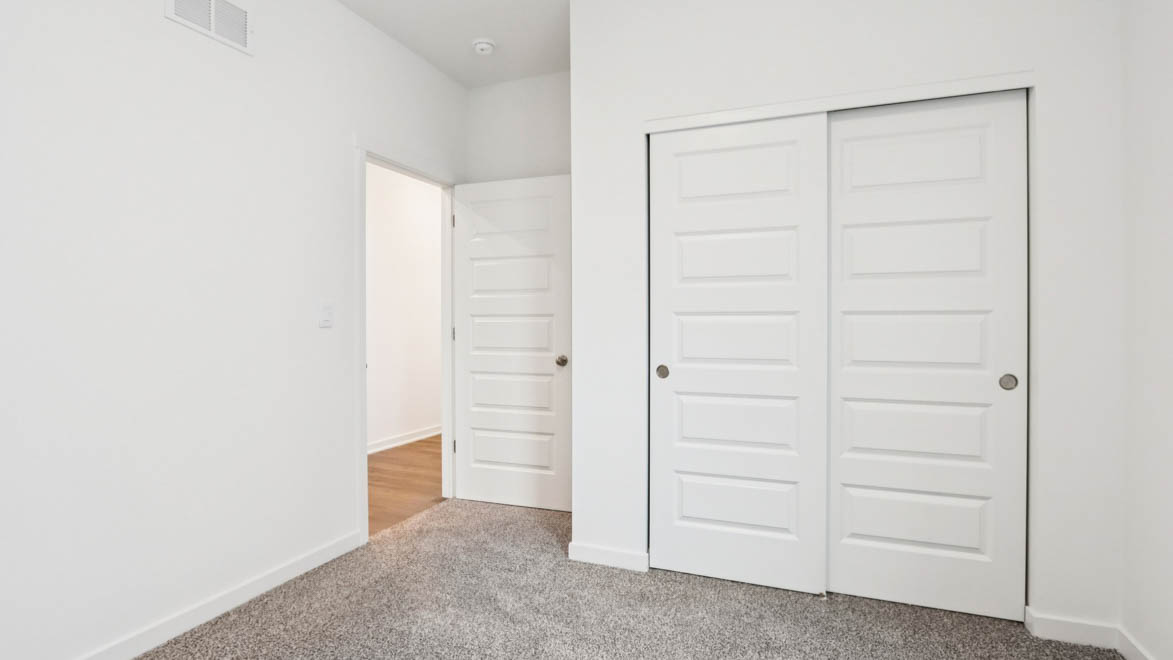 bedroom number 3 with full carpet