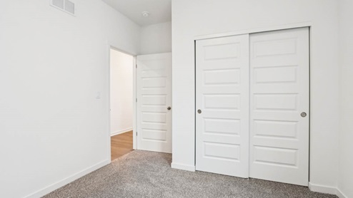 bedroom number 3 with full carpet