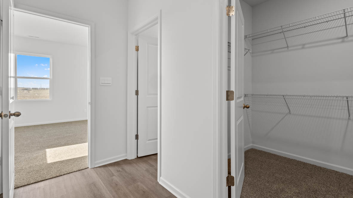 Hallway leading to laundry and bedroom 3