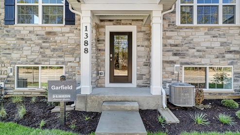 Close up of the front door of a 3-story townhome