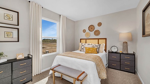 Upper level guest room with carpeted floors and a closet